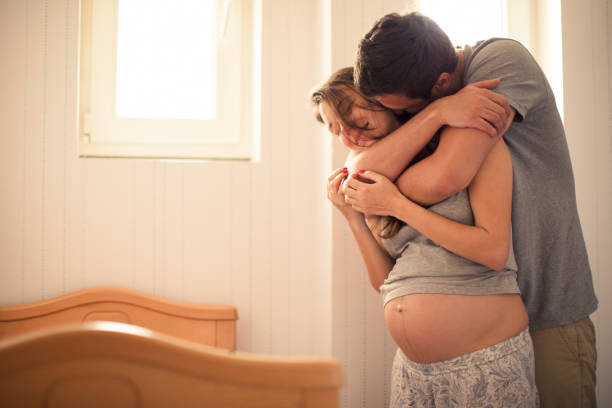 istock Happy man with pregnant woman 698019960