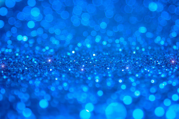 istock Blue bokeh light is the soft blurred circles of light white and light blue . Winter Christmas background texture Wallpaper concept 698022460