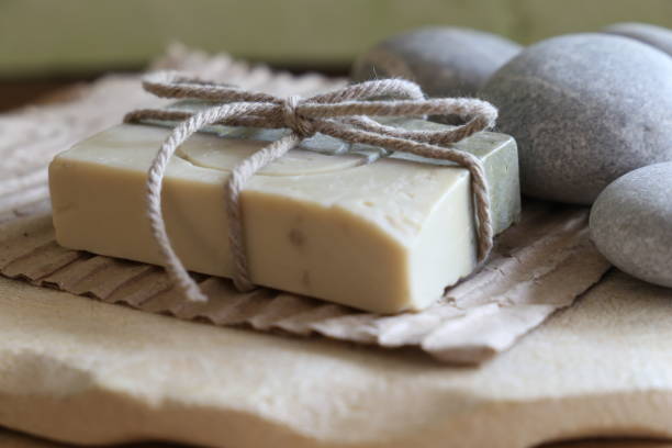 istock Set spa and wellness: handmade soap, white stones wooden background 698022616