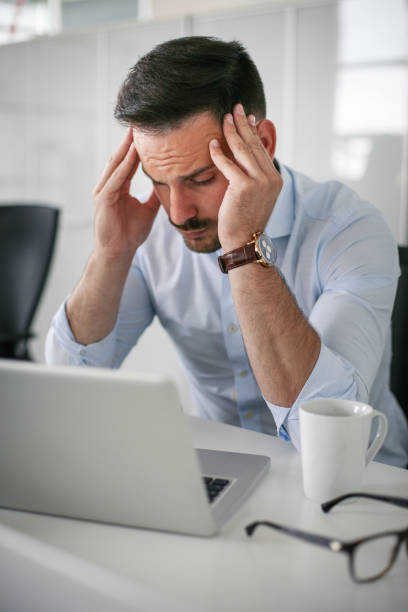 istock Business man having problem in the work. Business man sitting in office. 698026960
