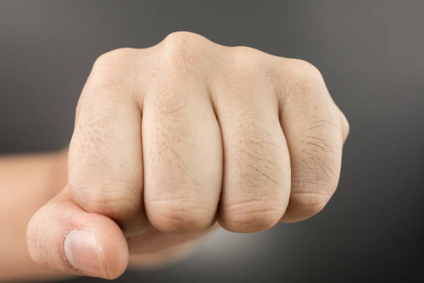 istock Man Punch fist on black 698030966