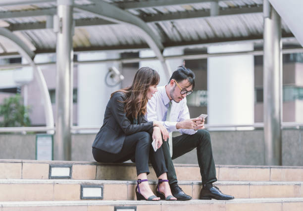 istock Business partners talking in an urban city setting 698035316