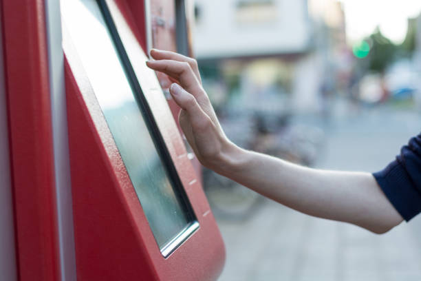 istock Touching on a red German ticket machine in the street 698040984