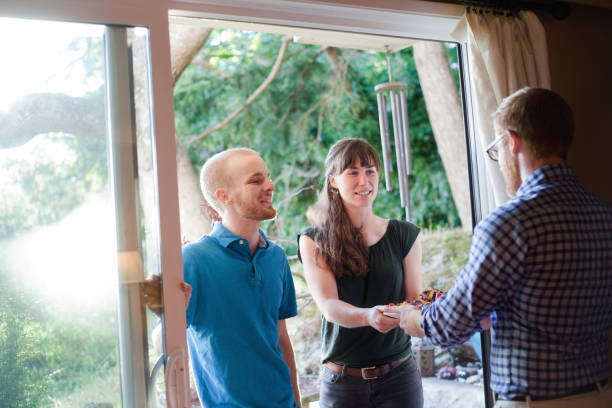 istock Greeting Friends at the Door 698047160