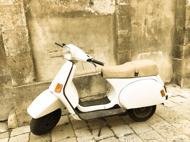 istock Vintage White Scooter, Ancient Sicilian Wall (Close-Up) 698050534