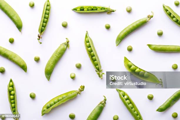 Peas Pattern Top View Of Fresh Vegetable On A White Background Repetition Concept Stock Photo - Download Image Now