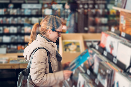 Woman enjoying records in the store