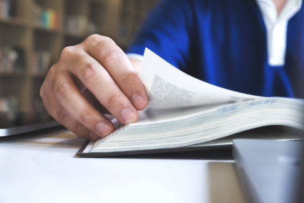 istock Man reading a book. Education, Academic, Learning and Exam concept. 698062106