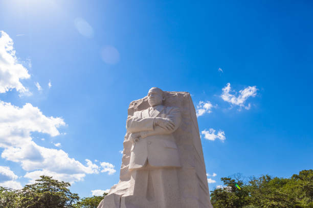 MLK Memorial Washington DC, USA - June 2017: The Martin Luther King Jr memorial sculpture stands tall on a sunny blue sky day. martin luther king jr memorial stock pictures, royalty-free photos & images