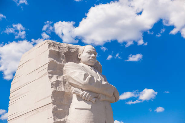 MLK Memorial Washington DC, USA - June 2017: The Martin Luther King Jr memorial sculpture stands tall on a sunny blue sky day. civil rights photos stock pictures, royalty-free photos & images