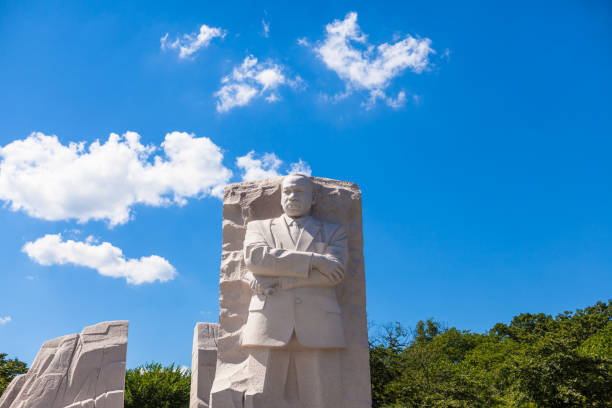 MLK Memorial Washington DC, USA - June 2017: The Martin Luther King Jr memorial sculpture stands tall on a sunny blue sky day. martin luther king jr memorial stock pictures, royalty-free photos & images