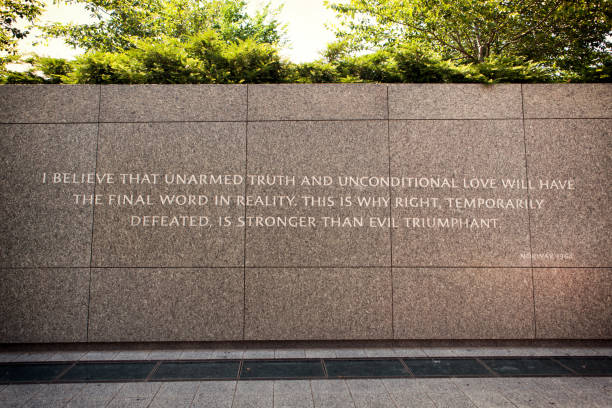 This is why right, temporarily defeated, is stronger than evil triumphant Washington DC, USA - June 2017: This quote is located by the MLK memorial. It reads "I believe that unarmed truth and unconditional love will have the final word in reality. This is why right, temporarily defeated, is stronger than evil triumphant. - Norway, 1964" martin luther king jr memorial stock pictures, royalty-free photos & images