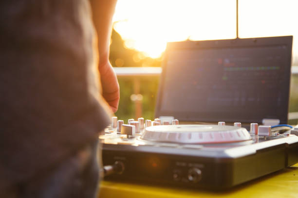 istock Dj mixing music outdoor. 698064020