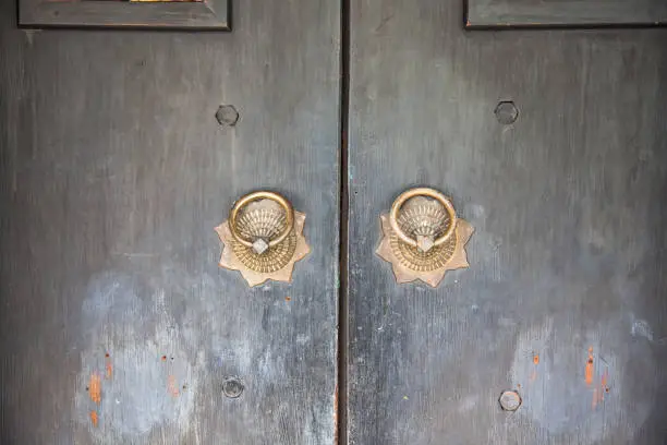 CloseUp image of old door with circle iron door-handle