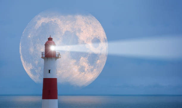 lighthouse and moon - storm lighthouse cloudscape sea imagens e fotografias de stock