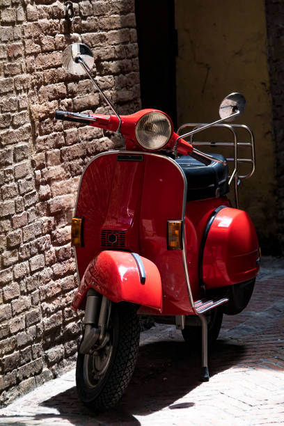 istock Vintage Red Italian Moped by wall 698071814