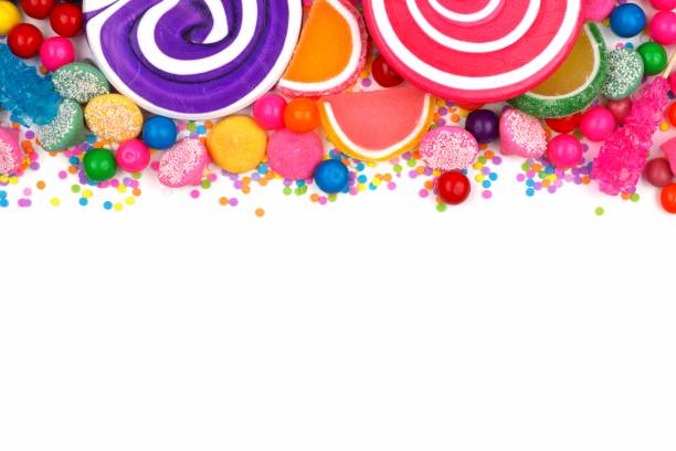 istock Top border of assorted colorful candies over white 698073254