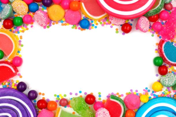 istock Frame of assorted colorful candies over white 698073268