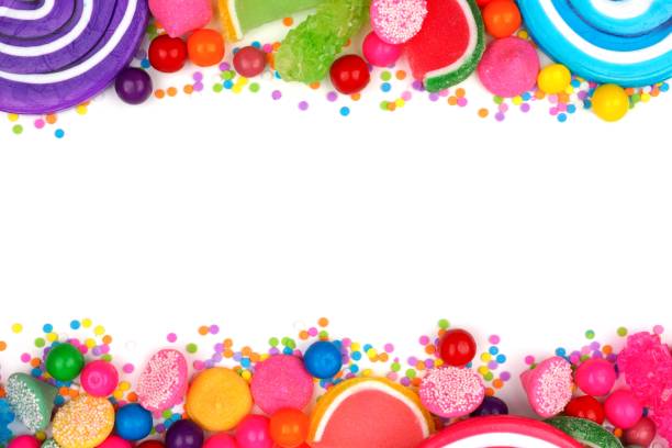 Double border of assorted colorful candies over white