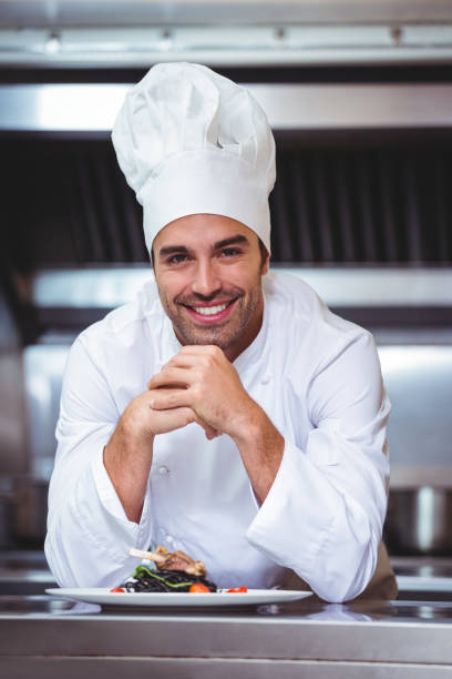 istock Chef leaning on the counter with a dish 698075514