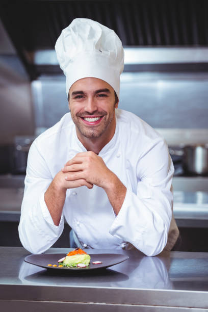 istock Chef leaning on the counter with a dish 698075580