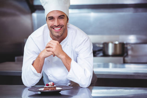istock Chef leaning on the counter with a dessert 698075648