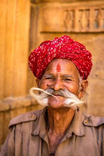 indian senior with a huge mustache in jaisalmer fort, rajasthan, india - jaipur city palace imagens e fotografias de stock