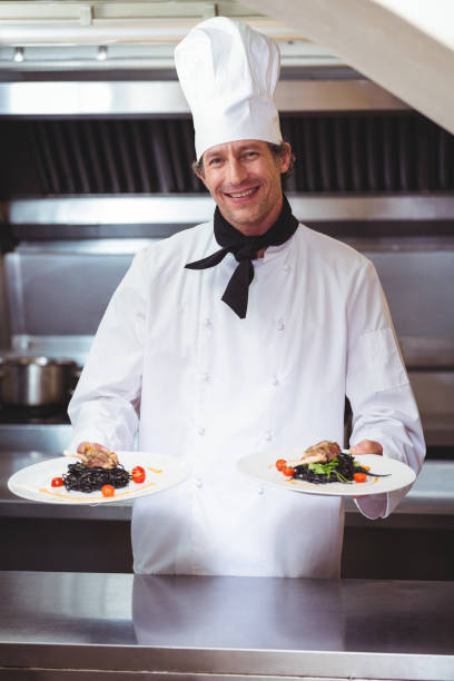 istock Chef showing plates of spaghetti 698076488