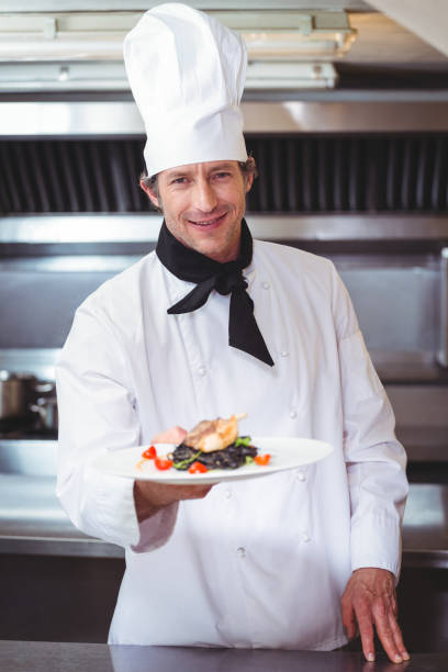 istock Chef showing plate of spaghetti 698076834