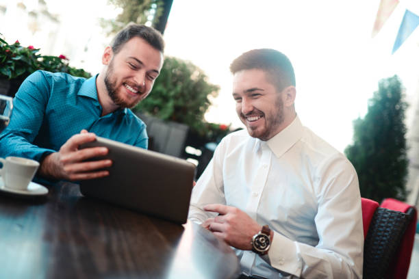 istock Business Colleagues using Digital Tablet in a Cafe Restaurant 698092214