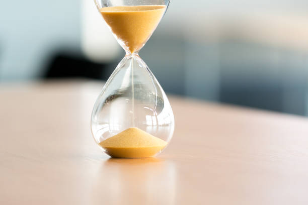 istock Sand clock, business time management concept 698096640