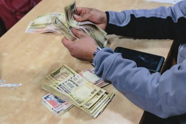 Photo of Rupee banknotes for car and guide in Sikkim, India