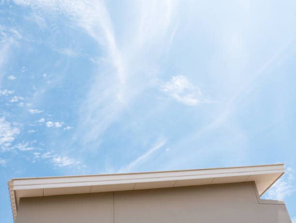 istock Sloped roof under the blue sky. 698103538