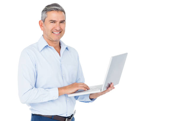 istock Smiling businessman typing on laptop 698108012