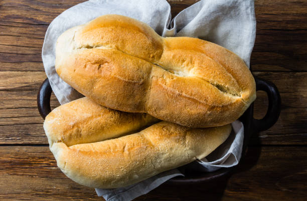 istock Chilean typical bread marraqueta on wooden background 698111008