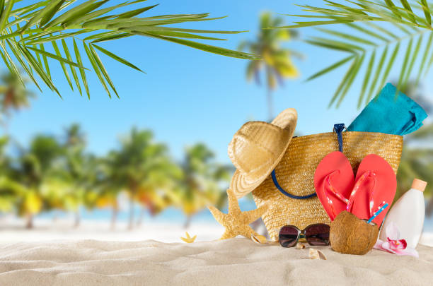 istock Tropical beach with accessories on sand, summer holiday background. 698123308