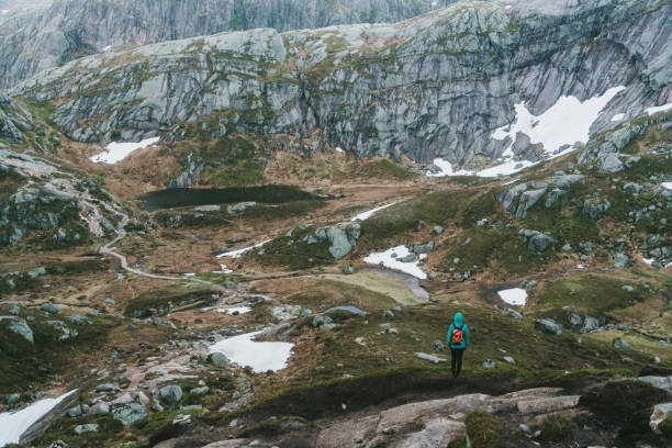 istock Woman hiking in mountains  in Norway 698123892