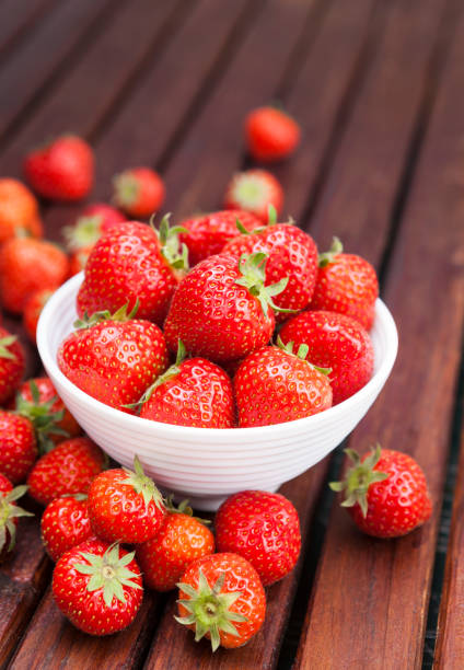istock Strawberry on wooden background. Copy space 698126850