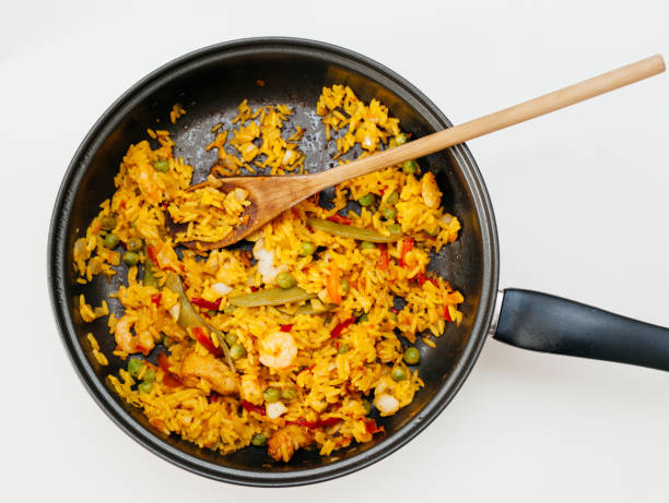 istock Fresh home made paella in pan - view from above readu to eat 698129844