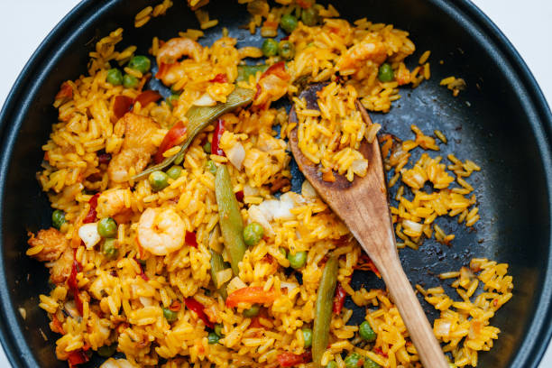 istock Fresh home made paella in pan - view from above readu to eat 698129928