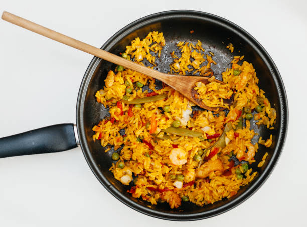 istock Fresh home made paella in pan - view from above readu to eat 698130144