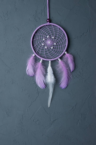 istock Lilac dream catcher on dark gray 698131422