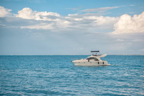istock White yacht sails on the sea 698131742