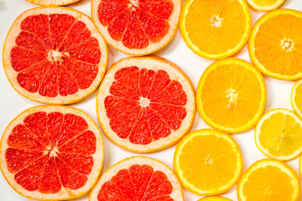 istock Gradient color citrus slices on white background 698131750