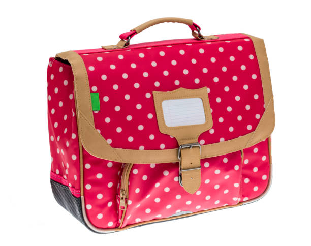 Fancy Red Schoolbag Fancy red schoolbag with white dots isolated against a white background. satchel stock pictures, royalty-free photos & images