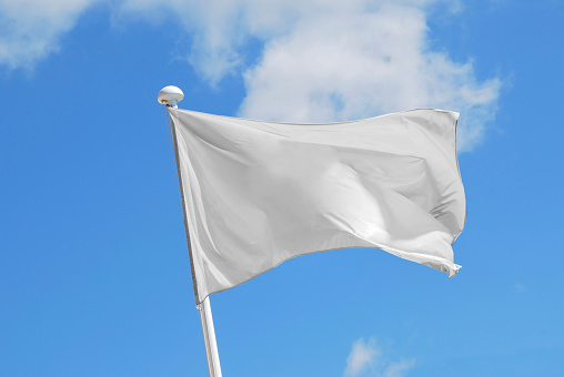 White flag waving over the sky. Promotional and advertisement object