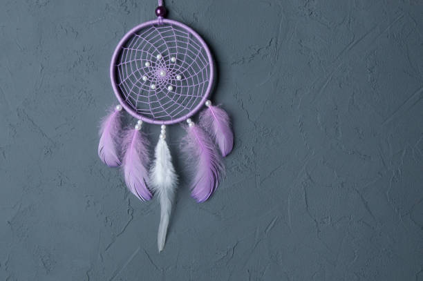 istock Lilac dream catcher on dark gray 698143462