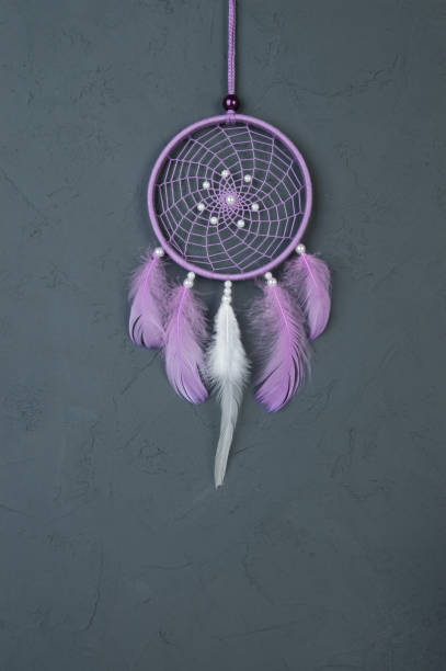 istock Lilac dream catcher on dark gray 698144590