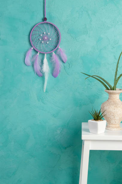 istock Lilac dream catcher on aquamarine 698144702