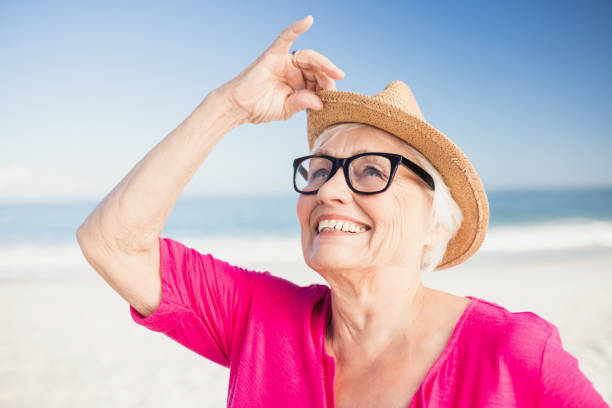istock Senior woman relaxing on the beach 698155840